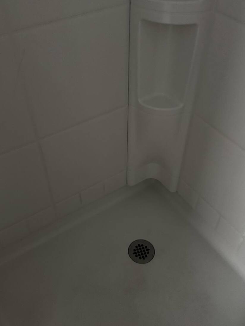 Same shower corner bright and clean after RX Cleaning Services deep cleaning